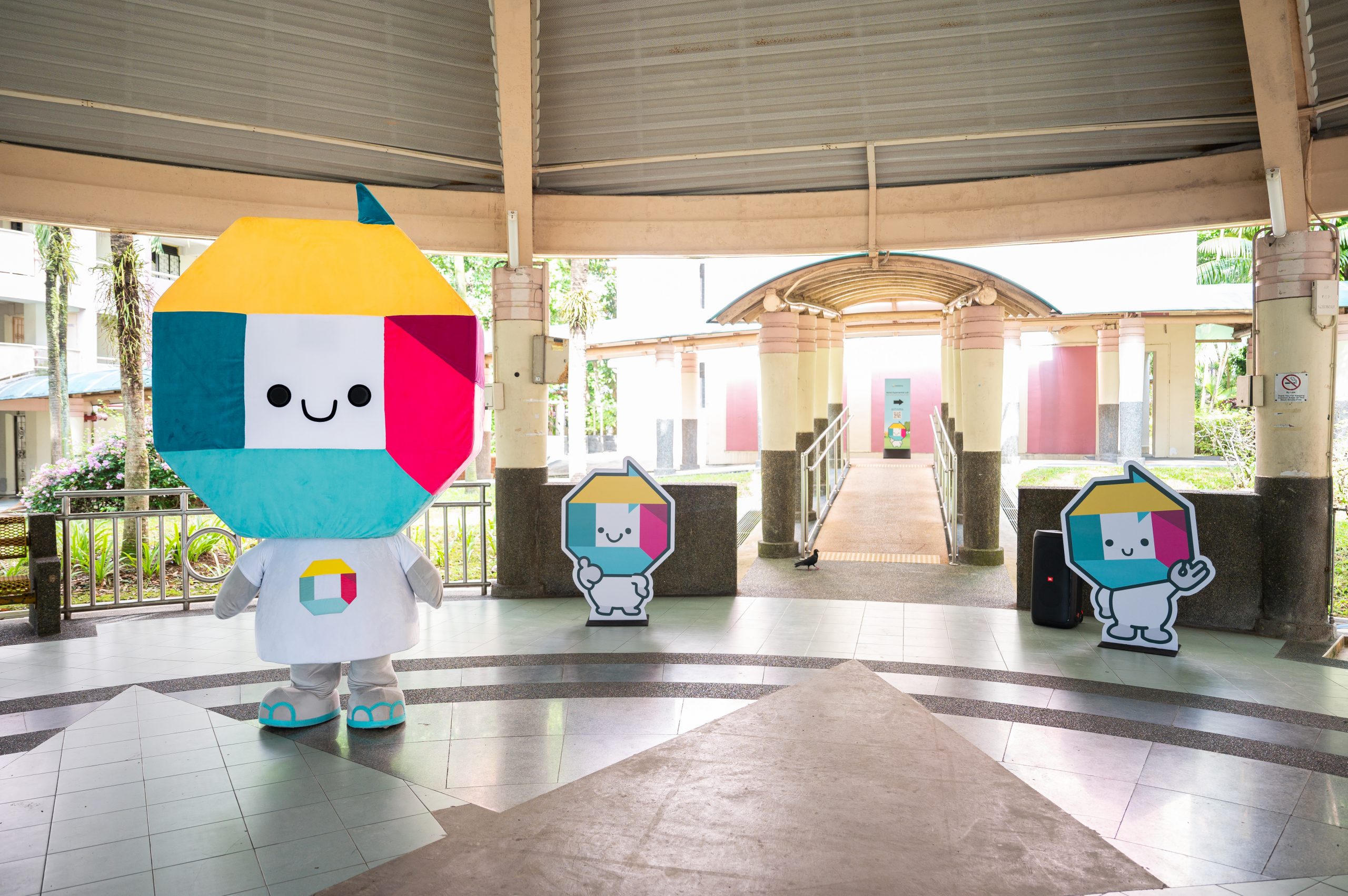 Kaki, the OneService mascot by the Municipal Services Office, guiding participants to the venue 